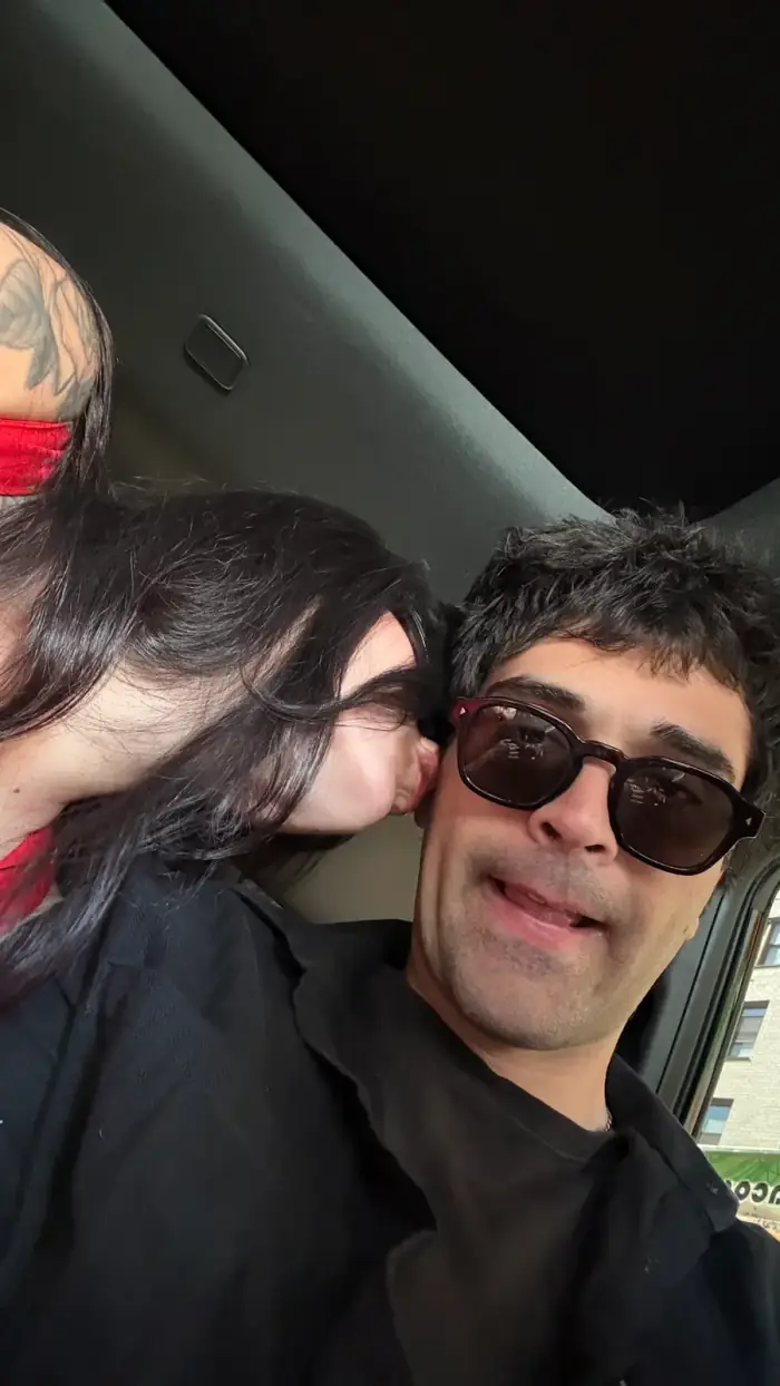the same car selfie again, tighter, both still in sunglasses