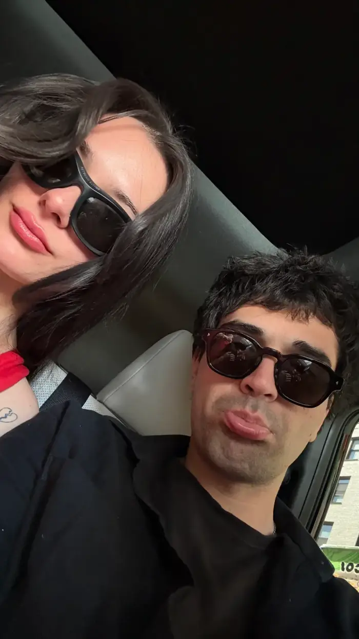 car selfie, both in sunglasses, olivia leaning into thomas
