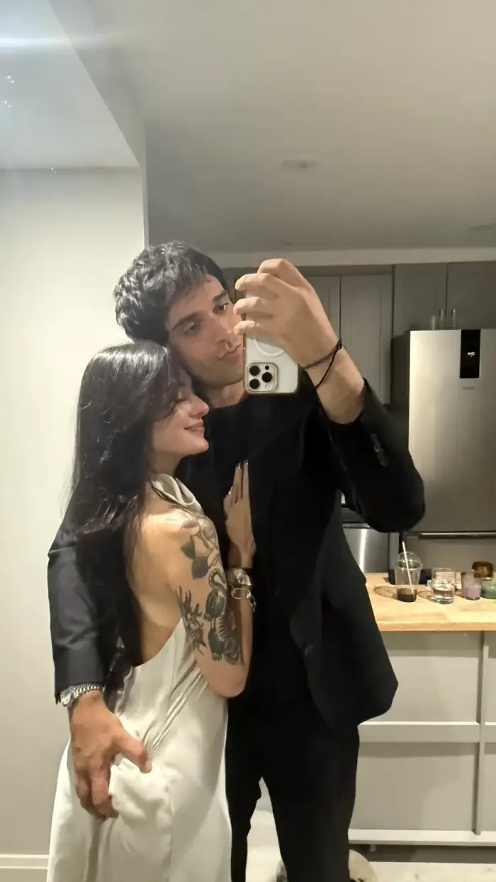 mirror, me in a black suit behind you, you in a white slip dress