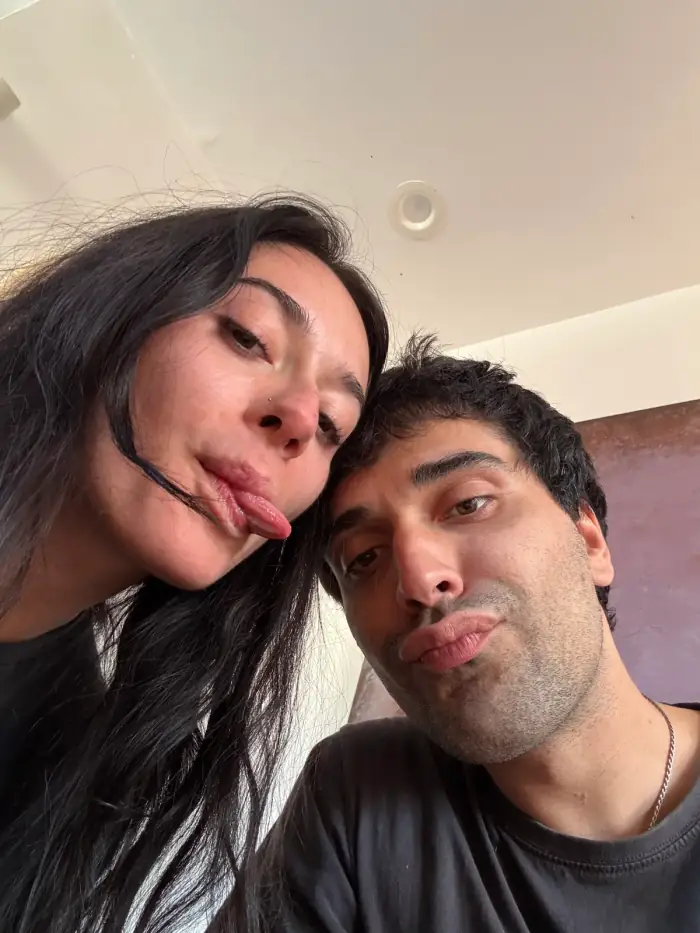 olivia with her tongue out, thomas beside her, close selfie