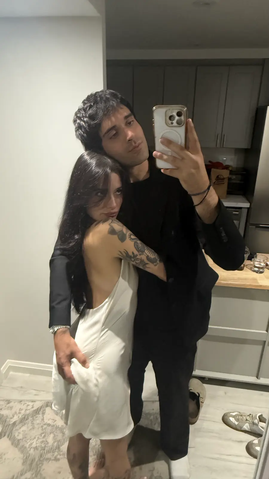 the other frame from the same mirror that night, white dress, my arms around you